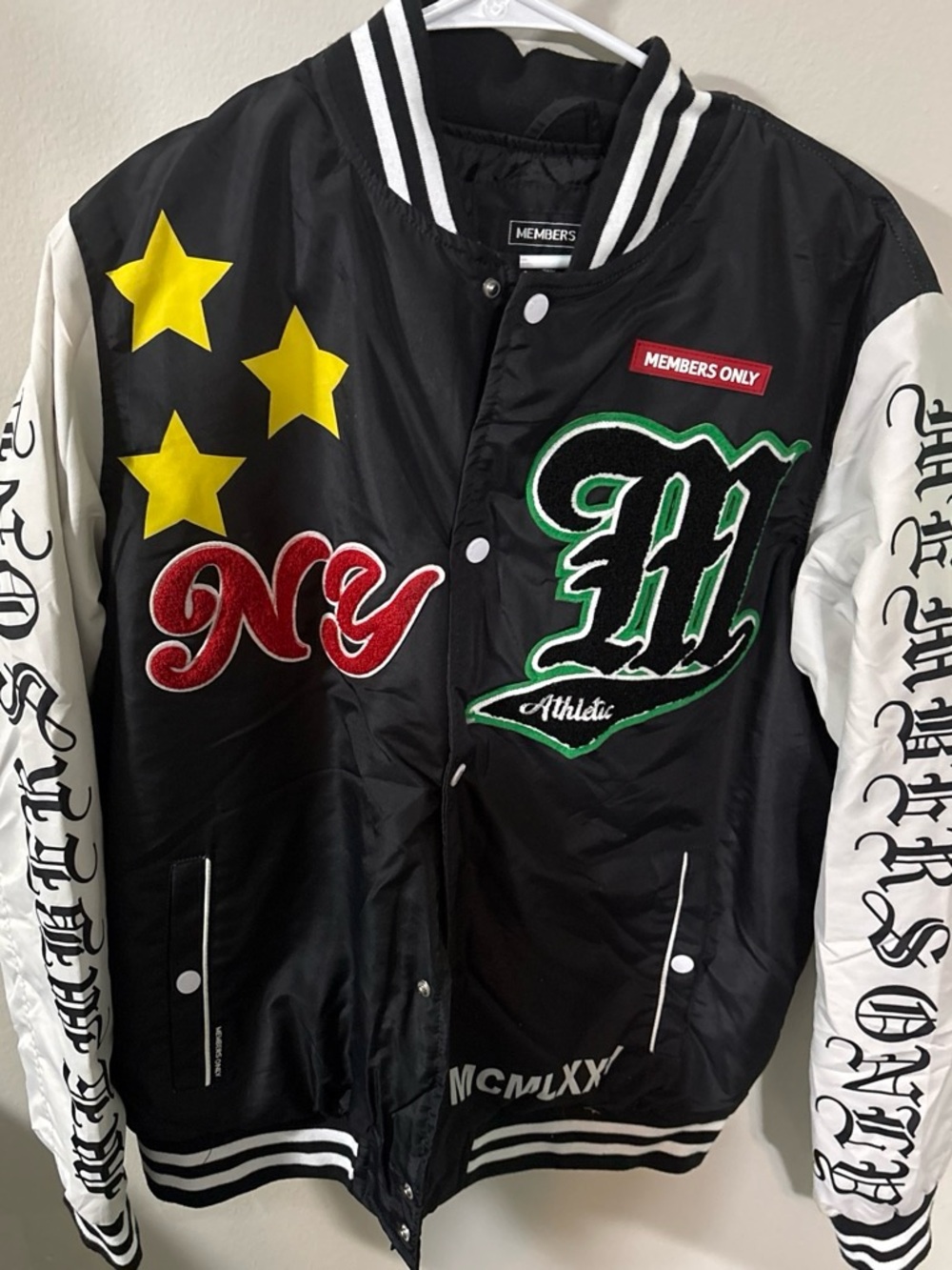 Members Only Black Bomber Jacket with White Sleeves and Yellow Stars